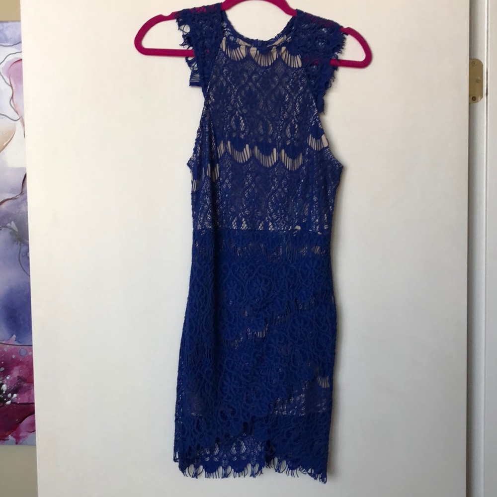 Royal blue lace dress with tan slip underneath.